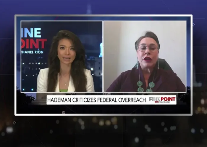 Video still from Fine Point on One America News Network showing a split screen of the host on the left side, and on the right side is the guest, Harriet Hageman.